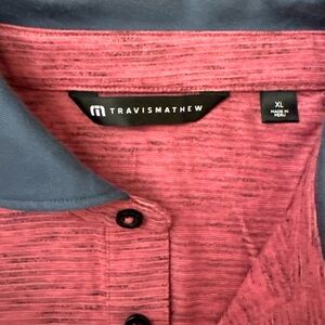 Travis Mathew Heathered Coral Polo with Navy Logo Patch